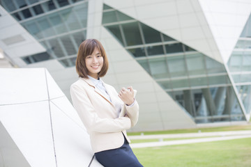 Fototapeta premium Attractive asian business woman working on tablet computer outsi