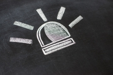 police flashers drawn with chalk on blackboard