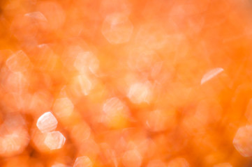 Brilliant orange background with bokeh hexagonal