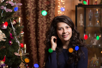 Smiling girl with Christmas tree