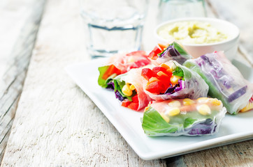 rainbow spring rolls with avocado white bean hummus