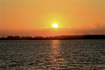 Naklejka premium Golden sunrise lights from Rickenbacker bay, miami florida