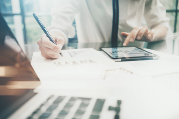 Investment manager work process.Photo business woman touchig modern tablet screen report.Statistics graphic screen.Banker  signs document,new startup,marketing plans.Horizontal,bokeh and film effects