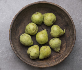 top view of a bowl with green pears