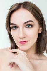 Fototapeta premium Beauty portrait of a pretty girl with makeup matte shadows on the eyes and pink lips