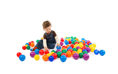 Obraz premium baby plays with color balls