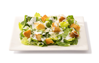 Caesar salad in a white plate