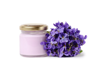 Obraz na płótnie Canvas Organic cosmetic cream with beautiful violet flowers isolated on white background
