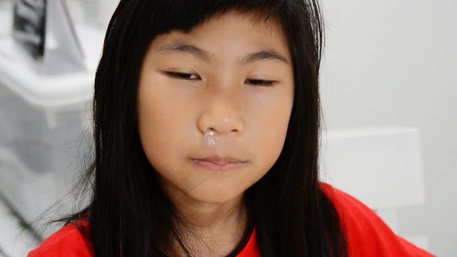 Sick girl with sneezing