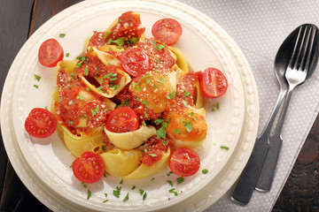 Lumaconi pasta with tomato sauce, bruschetta and salad