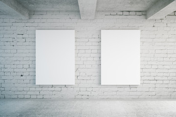 Blank posters on brick wall