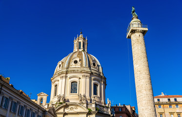 Obraz premium Trajan's Column and Santissimo Nome di Maria al Foro Traiano Church in Rome