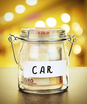 Jar for savings full of banknotes on bright background