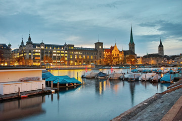 Fototapeta premium Night panoramic photo of city of Zurich and reflection in Limmat River, Switzerland