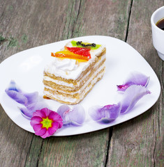 the fruit cake on a white plate decorated with flowers