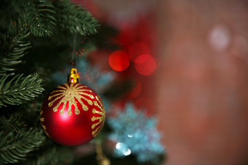 Christmas tree with decor on bright background, closeup