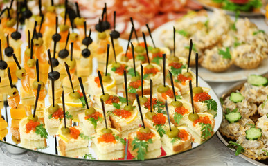 Dish with assorted snacks on a table