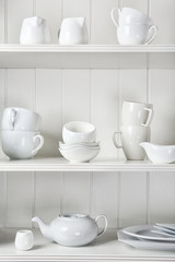 Dishes in cupboard in the kitchen