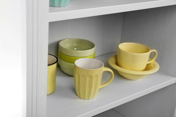 Dishes in cupboard in the kitchen