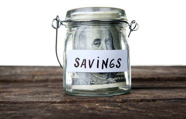 Jar for savings full of banknotes