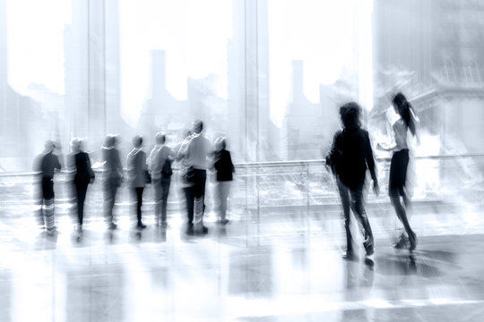 group of people in the lobby business center and blue tonality