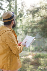 Hiker in nature. man in nature using map
