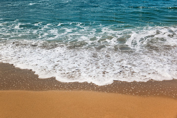 Fototapeta na wymiar wave of the sea on the sand beach