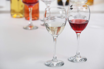 Wine glasses with red and white wine, closeup