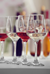 Wine glasses with red and white wine, closeup