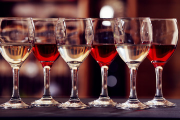 Glasses of red and white wine closeup