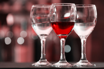 Glasses of red and white wine closeup