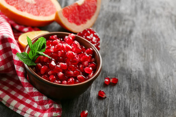 Juicy composition of tropical fruits on wooden background