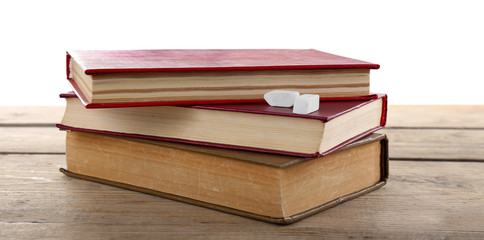 Few books with chalk on table