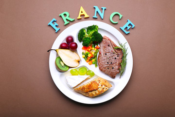 Traditional French lunch on brown background