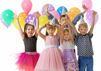 Happy group of children with having fun at birthday party, isolated on white