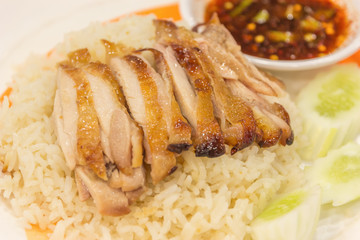 Grill chicken with hot and spicy sauce served with steam rice -