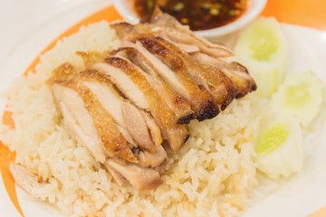 Grill chicken with hot and spicy sauce served with steam rice -
