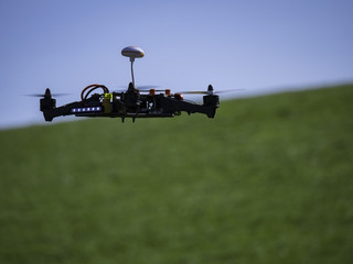 Racing Drone on Green Field
