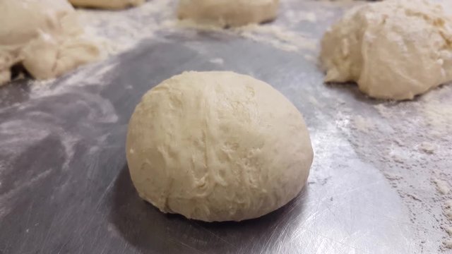 Raw wheat buns, at a bakery restaurants kitchen