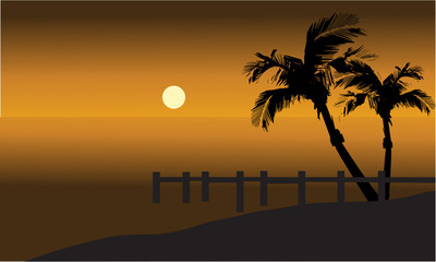 Palm trees on beach and pier silhouette