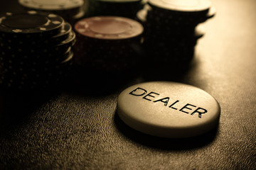 Obraz na płótnie Canvas Dealer Button with Poker Chips
