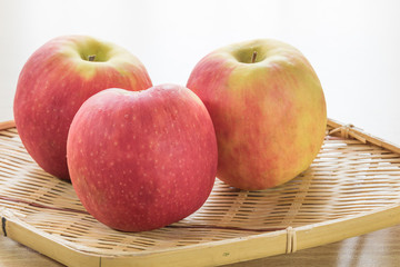 Red apple in basket
