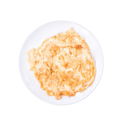 Close-up of omelette with plate isolated on a white background