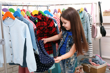 Little girl trying on a new dress