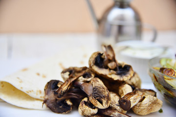 Roasted mushroom, leek and taco wrap with yogurt sauce