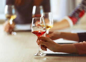 Experts tasting new sorts of wine at the table