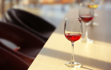 Glasses of red wine on the table, close up
