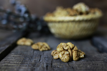 Fototapeta premium peeled walnut on a wooden background