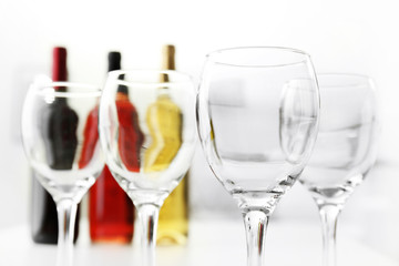 Wineglasses on blurred interior background