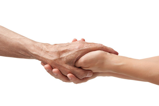 Hands of an elderly man holding the hand of a younger woman